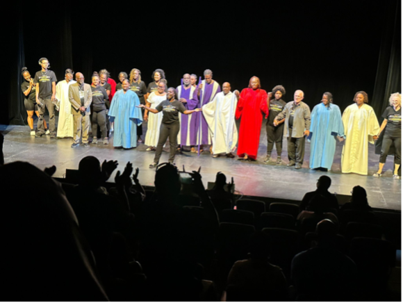 The Journey company on stage before the audience.