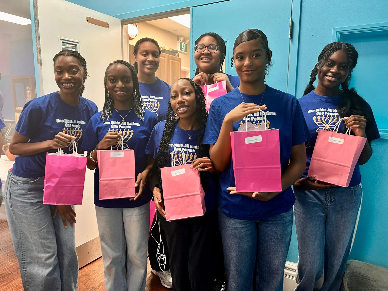 Young people of the congregation together with gift bags.