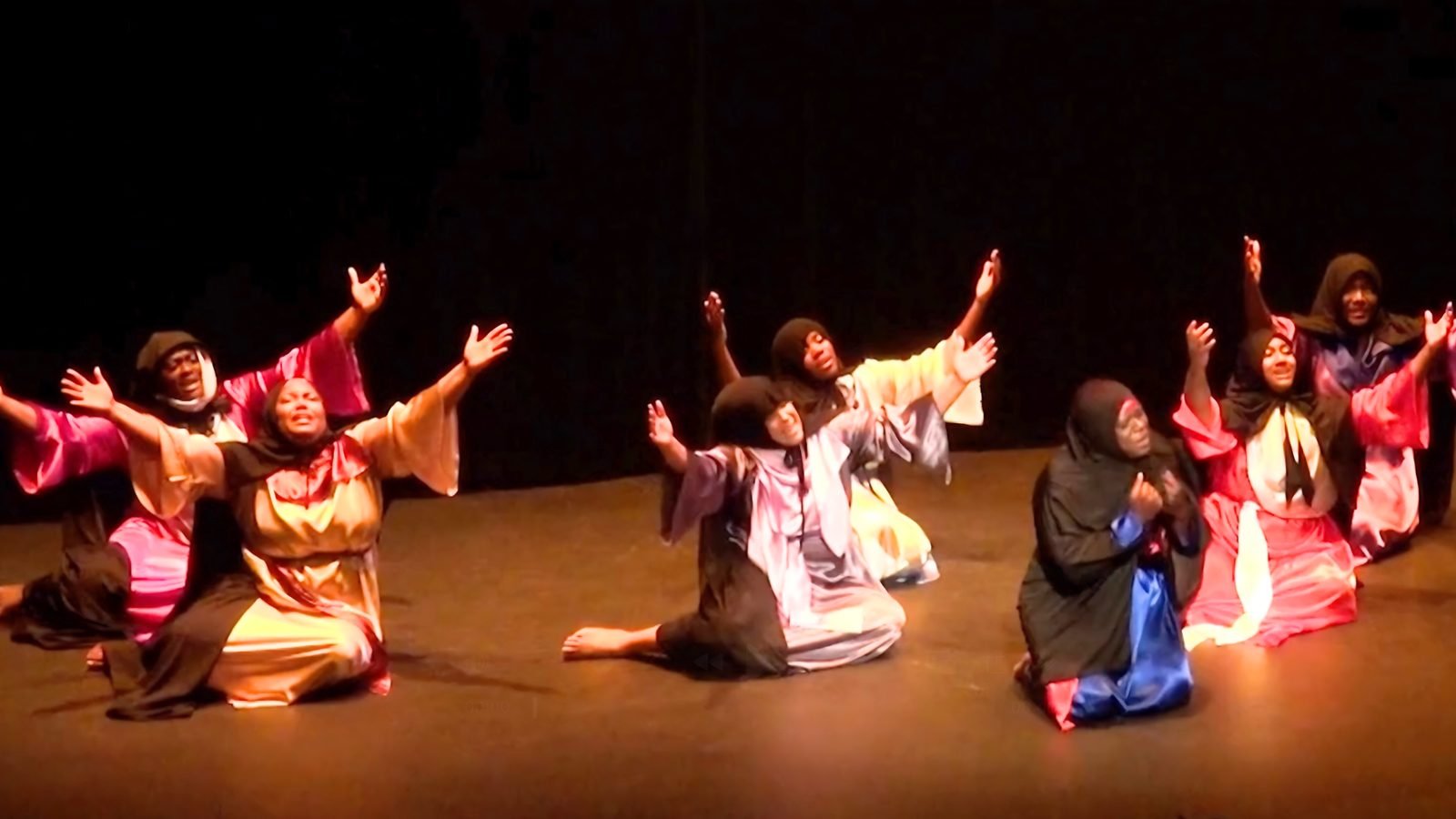Dancers performing The Journey on stage.
