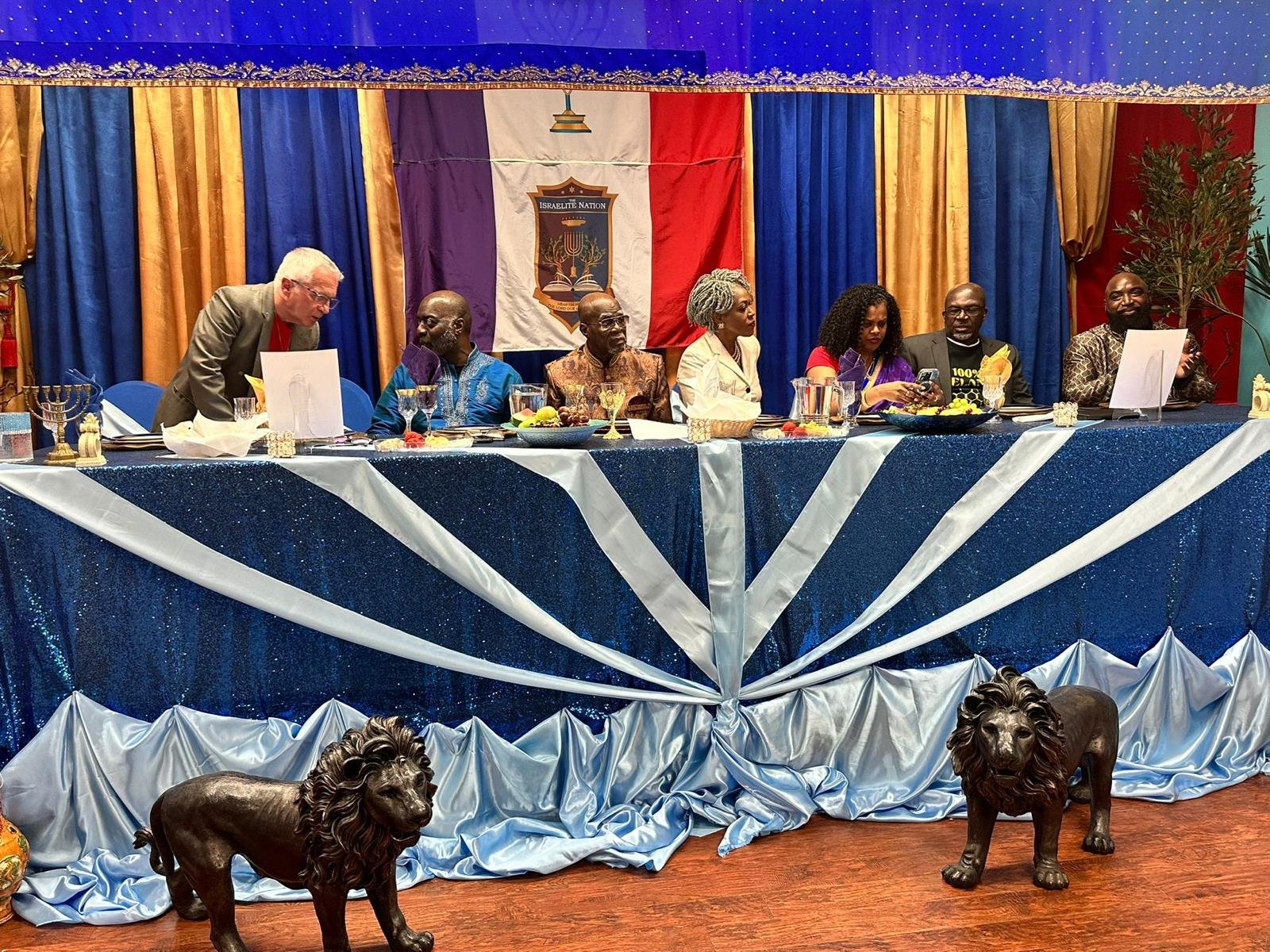 Elders seated at the head table during a teaching.
