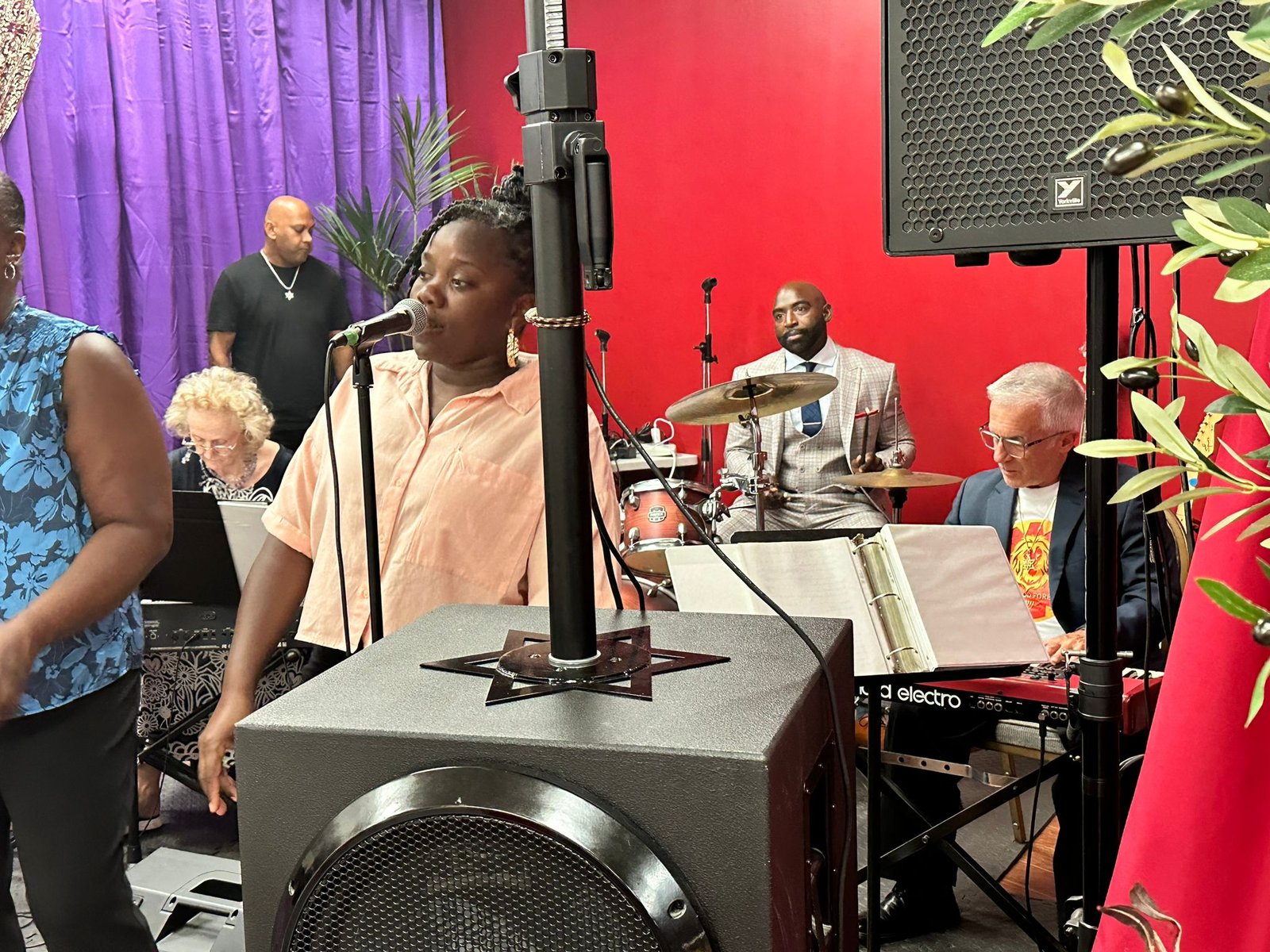 The congregation singing together at a celebration.